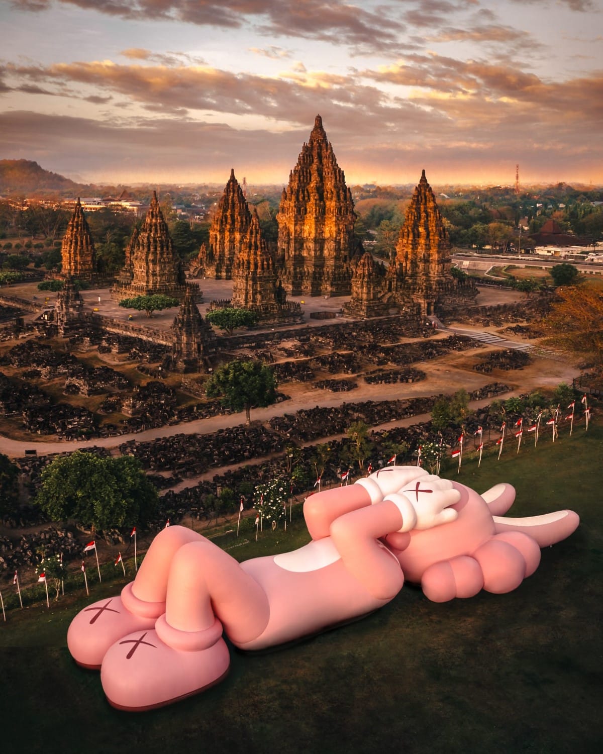 150-Foot Sculpture of a Pink Rabbit Lies Down in Front of Indonesia`s Prambanan Temple